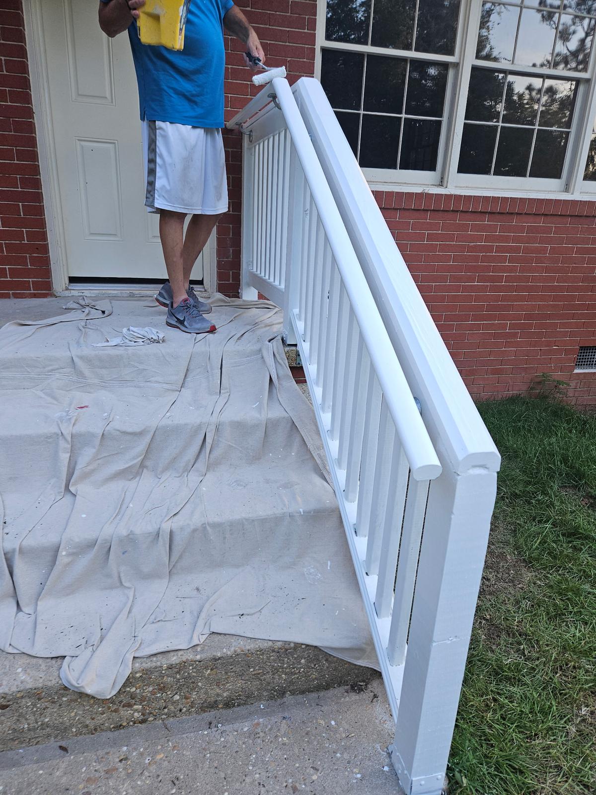 Painting a freshly built porch railing white