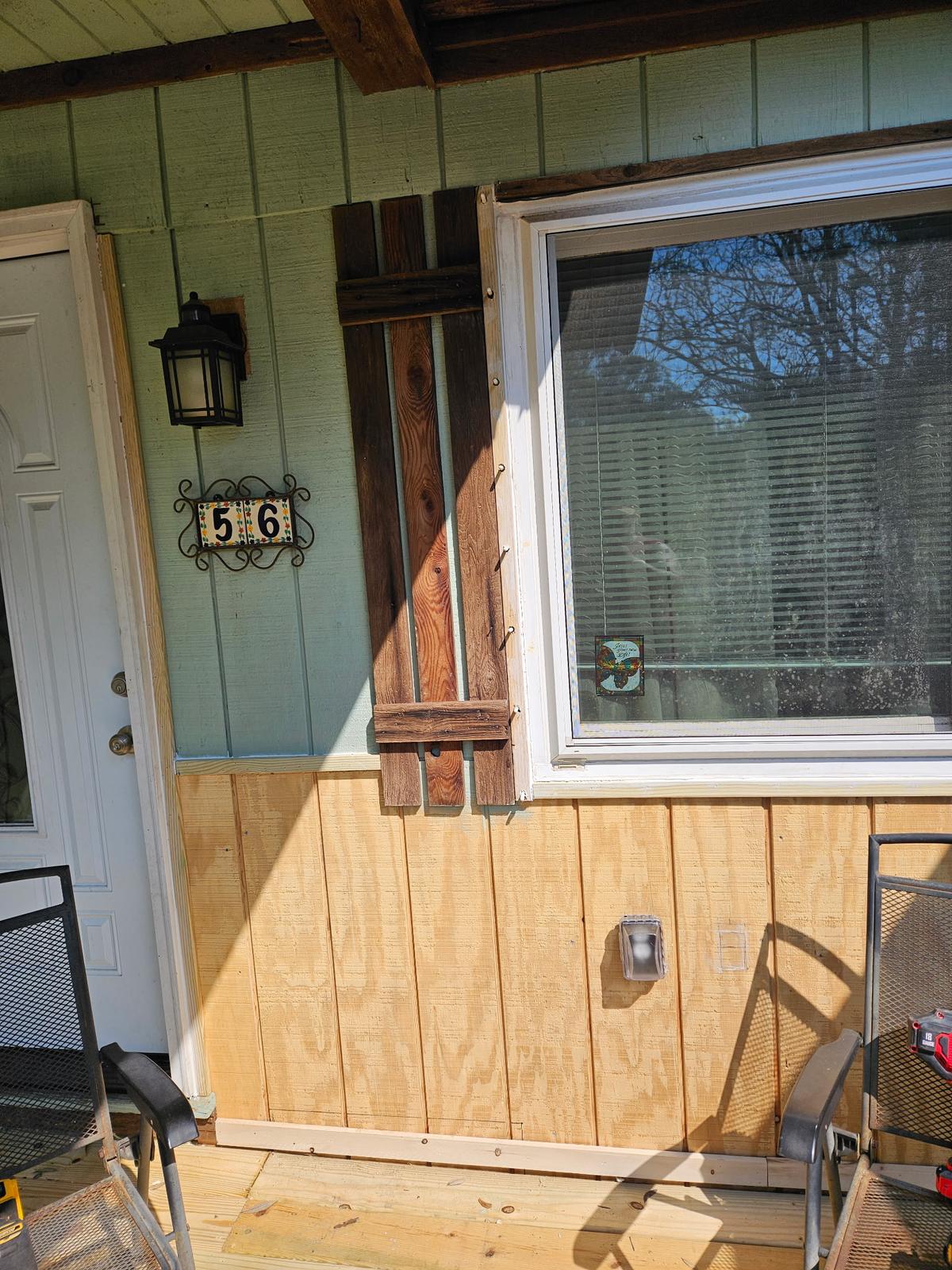 Custom rustic barnwood shutters and window trim