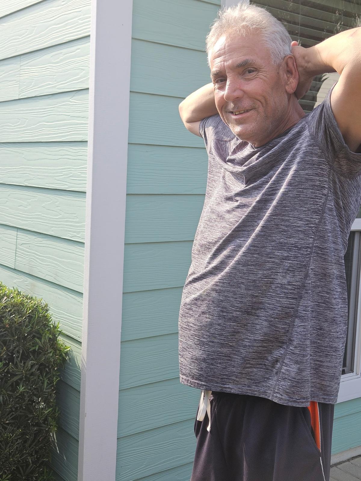 Scott Floyd, owner of Floyd's Finishing Touch, smiling on the job in Valparaiso, FL
