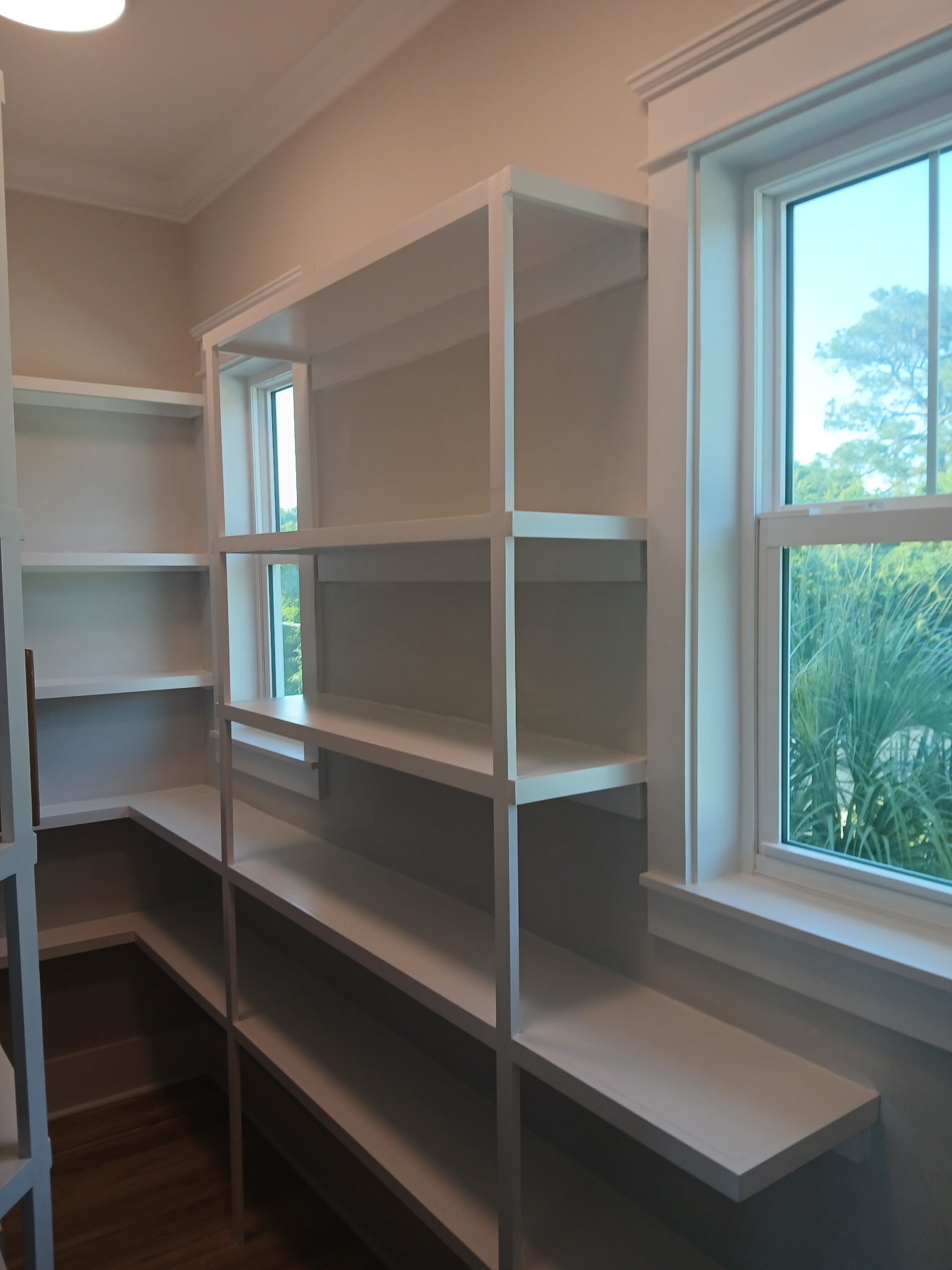 Pantry after — beautiful custom built-in shelving complete